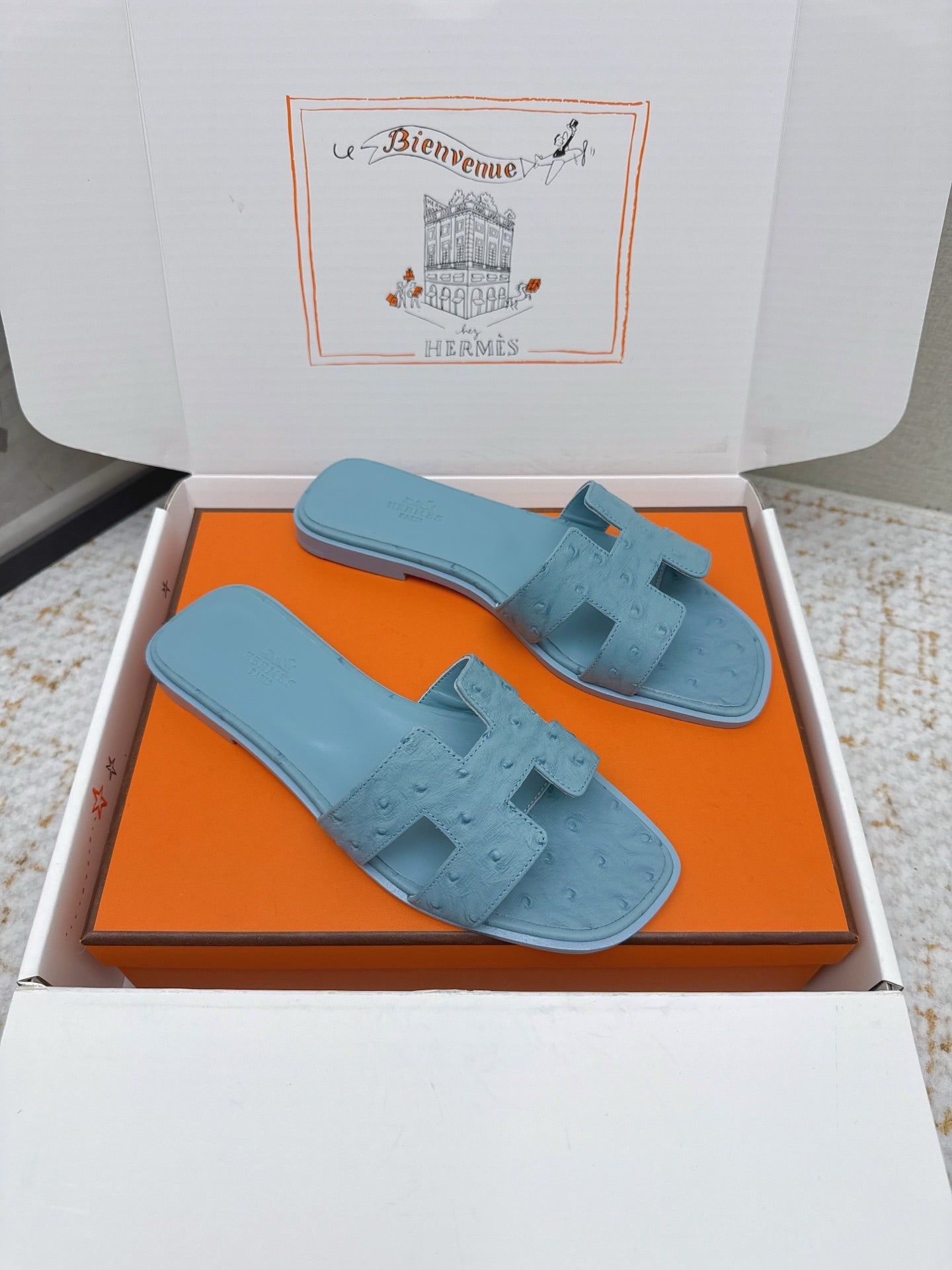 HM 26ss Oran Sandals Light Blue Ostrich Leather 625103